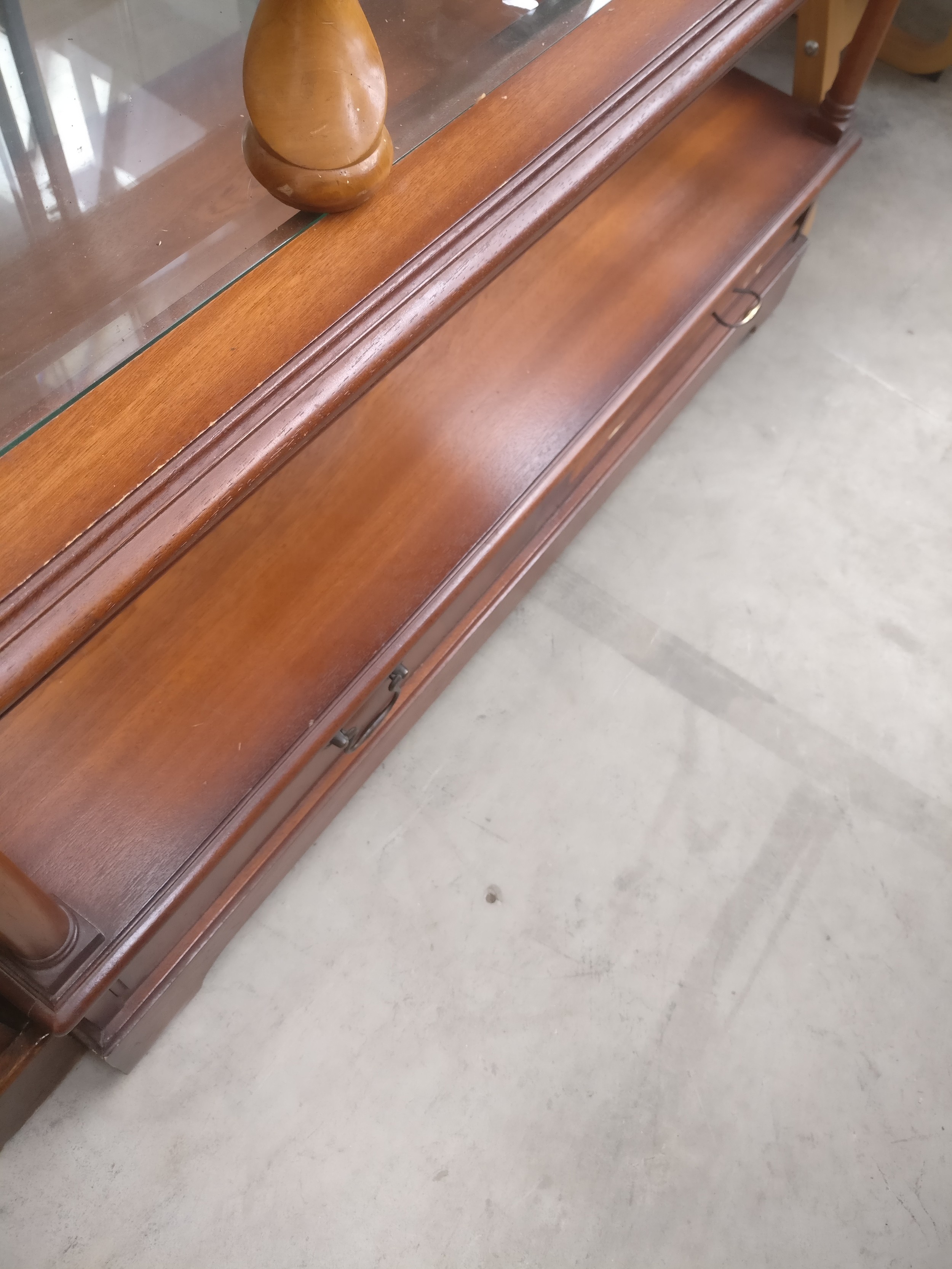 A vintage 2 tier coffee table with glass top and lower drawers
