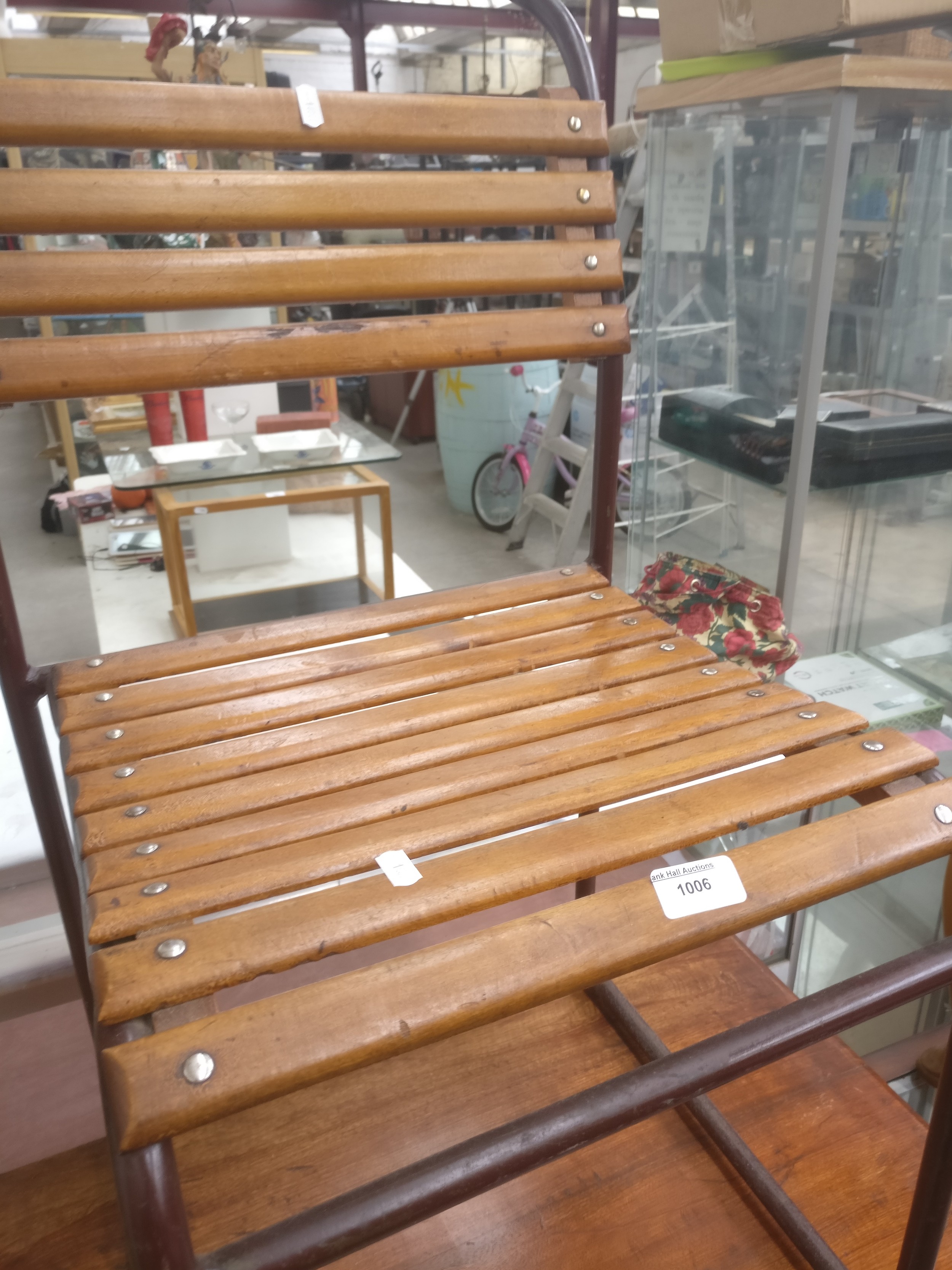 A vintage metal framed stand chair with slatted wood seat