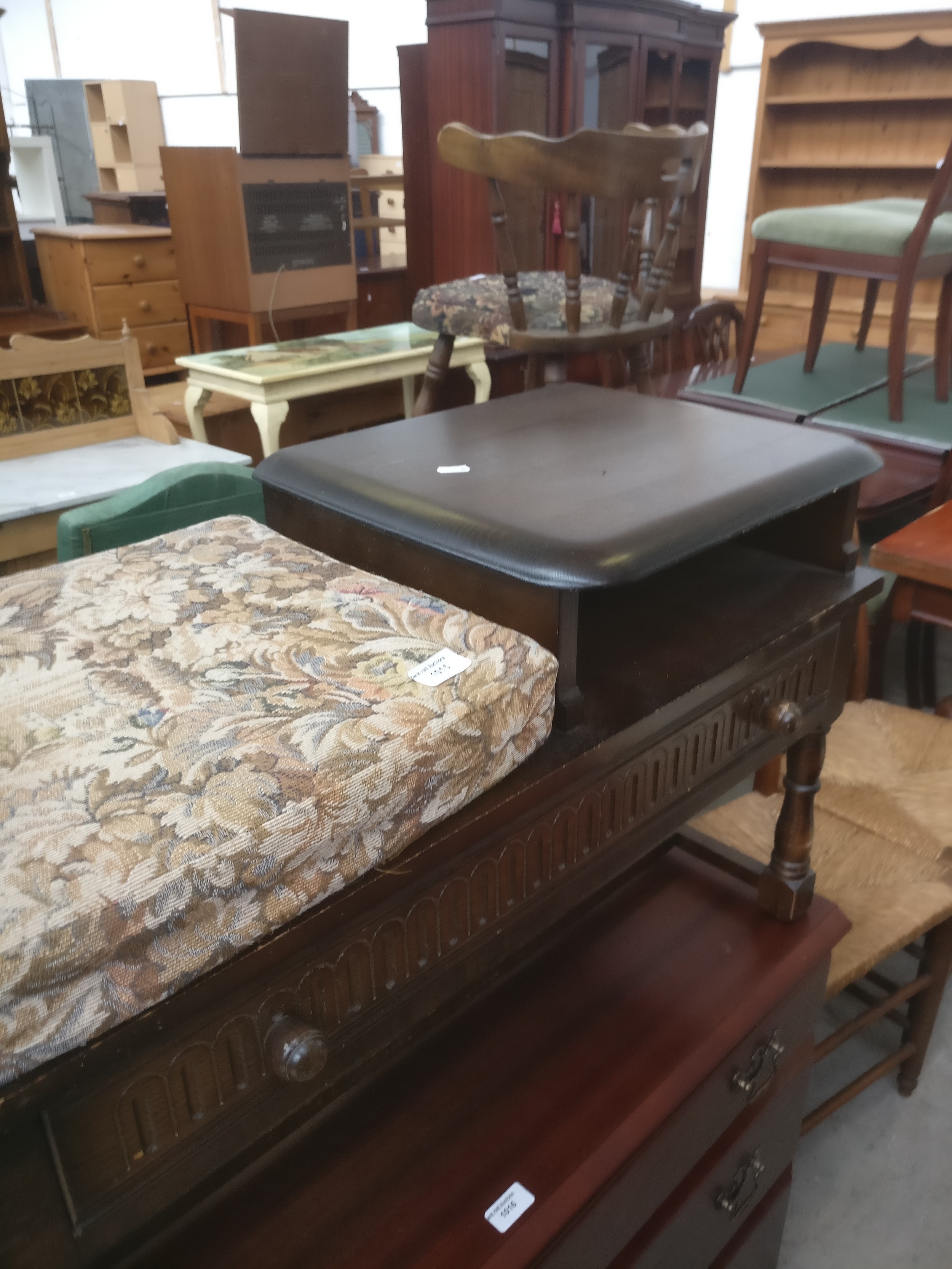 A small vintage hall seat with table, drawer and cushioned seat