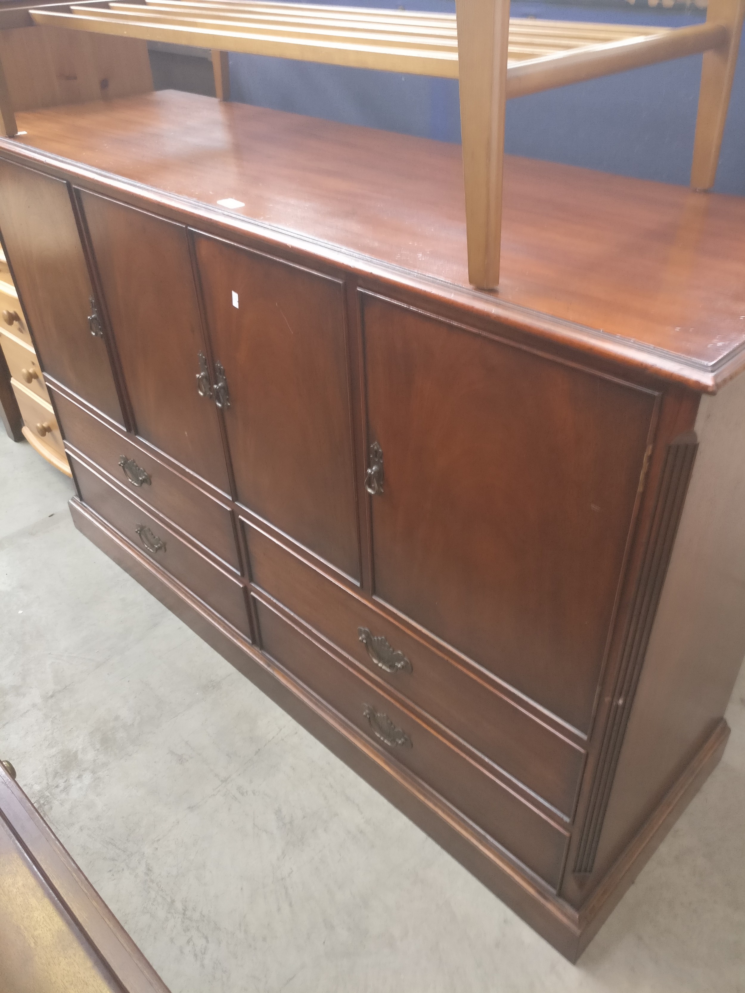 A large vintage mahogany sideboard base unit with 4 door cupboards over lower 4