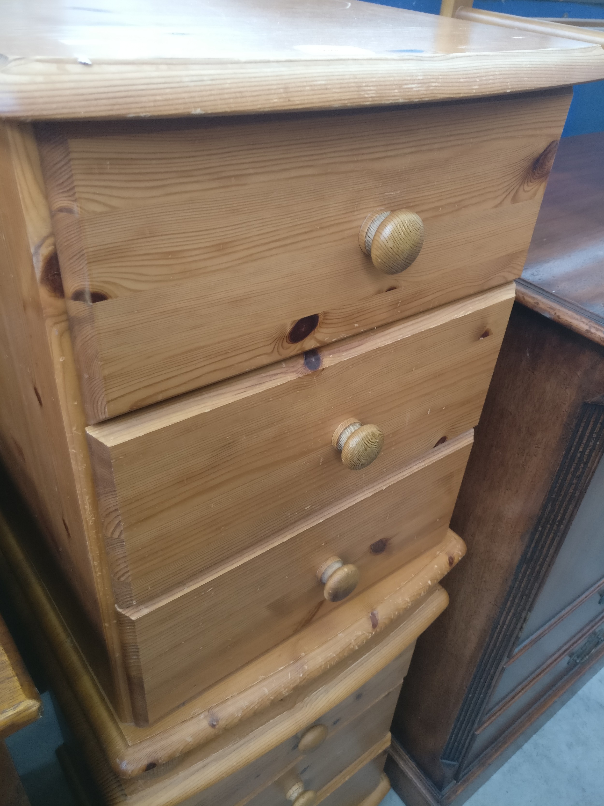 A pair of vintage pine 3 drawer bedside chests