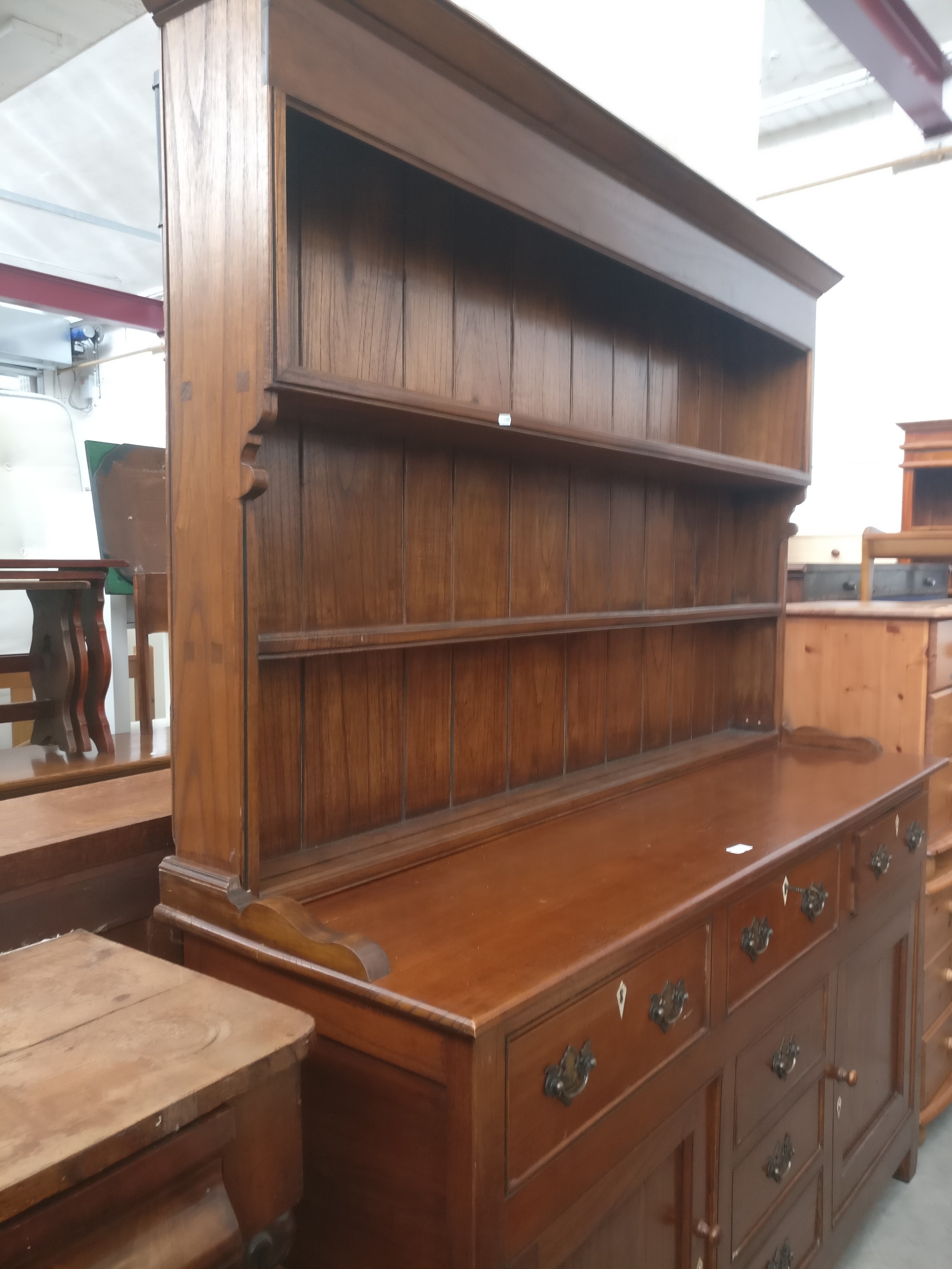 A large vintage dresser with lockable 6 drawer and double cupboard base