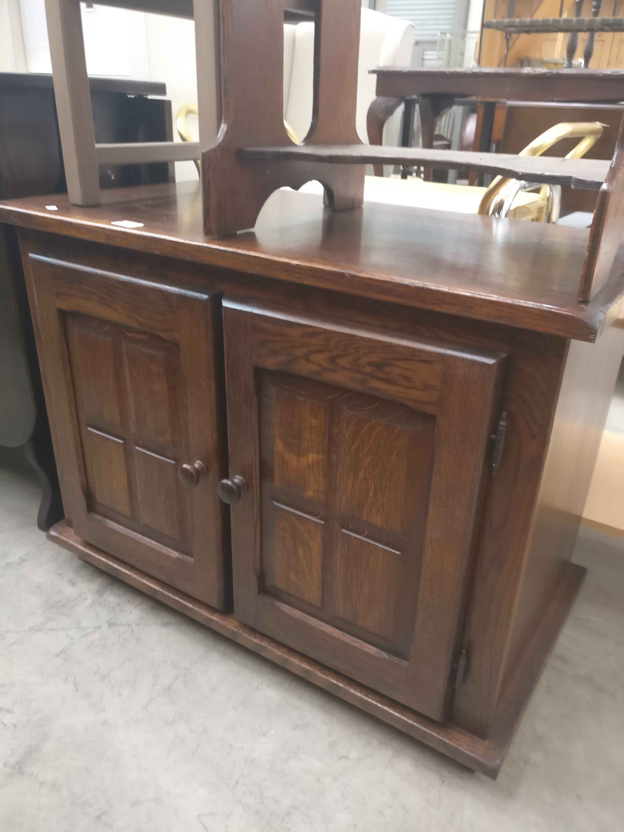 A small vintage oak 2 door base cupboard with replacement back