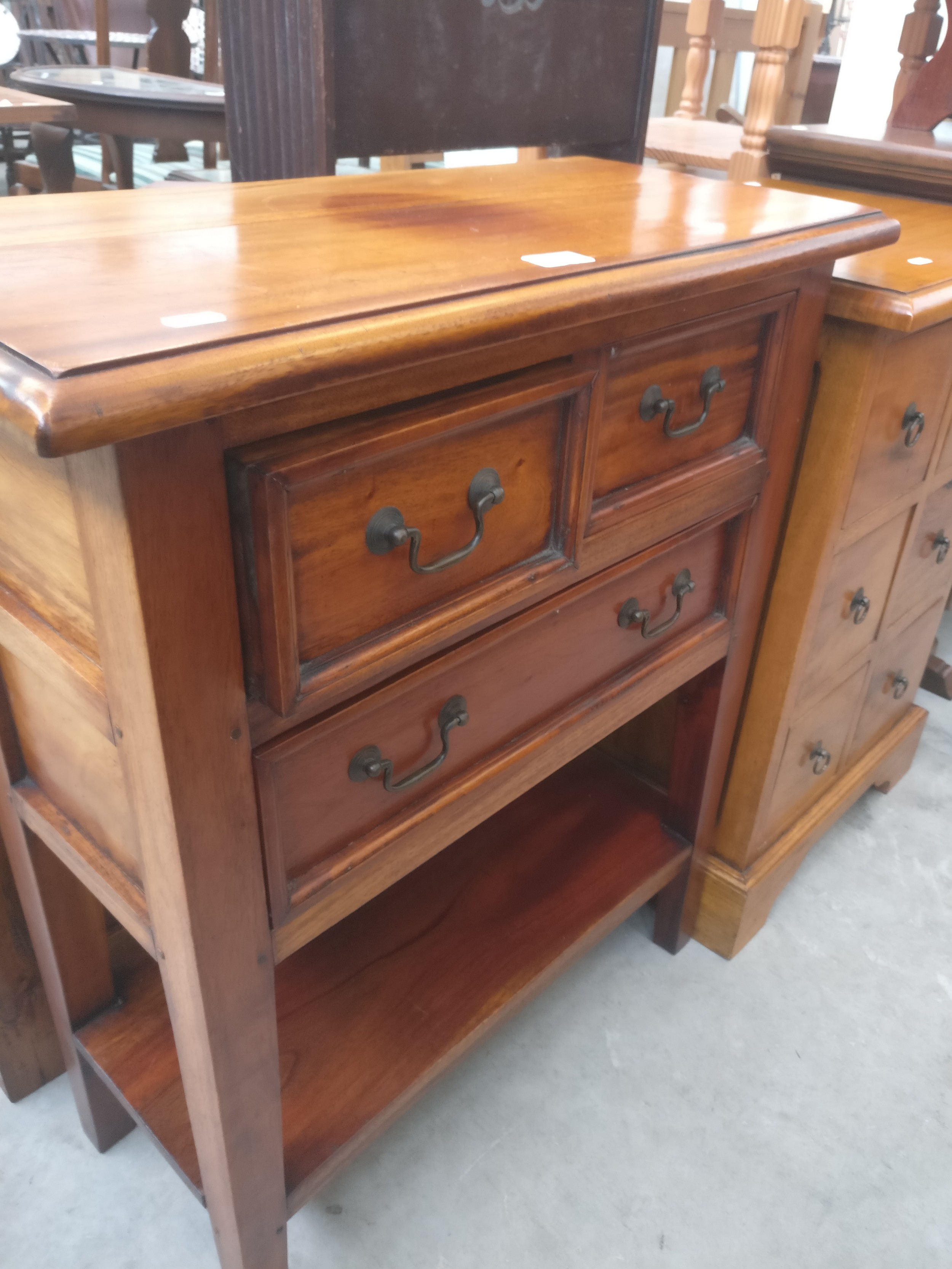 A small hardwood console table stand with 2 over 1 lower drawers and shelf