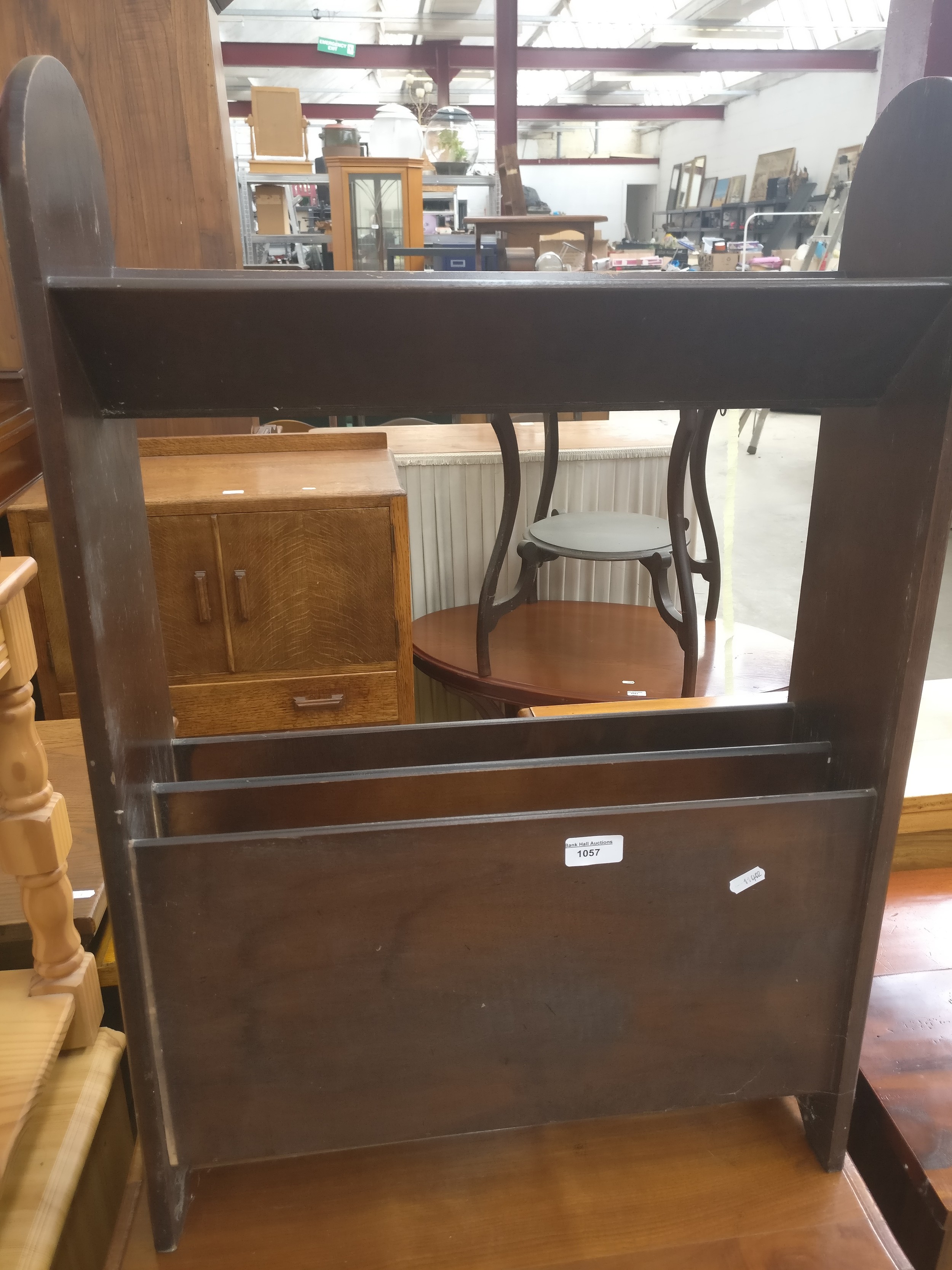 A small vintage book trough stand with lower magazine rack