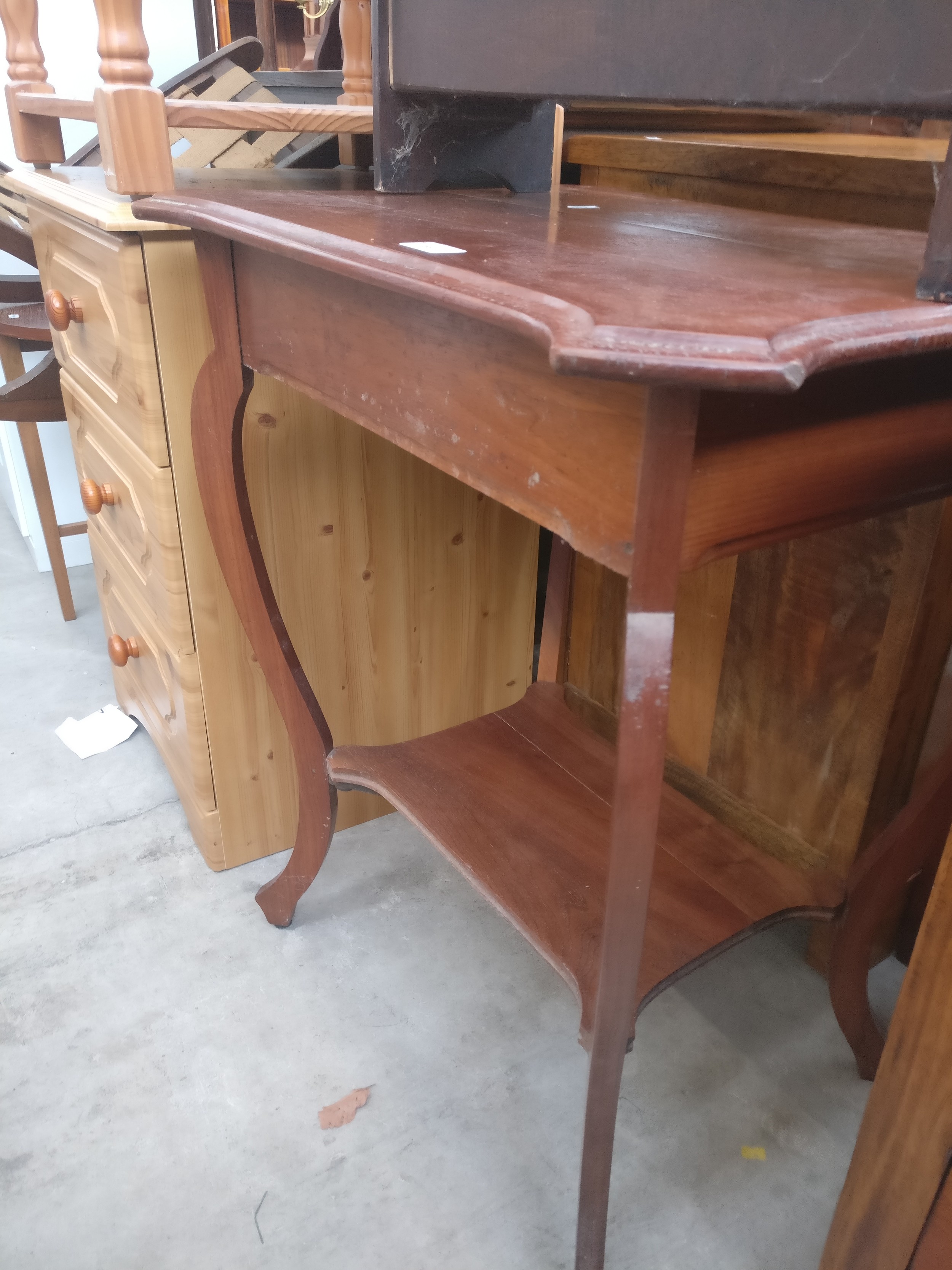 A small vintage 2 tier window table