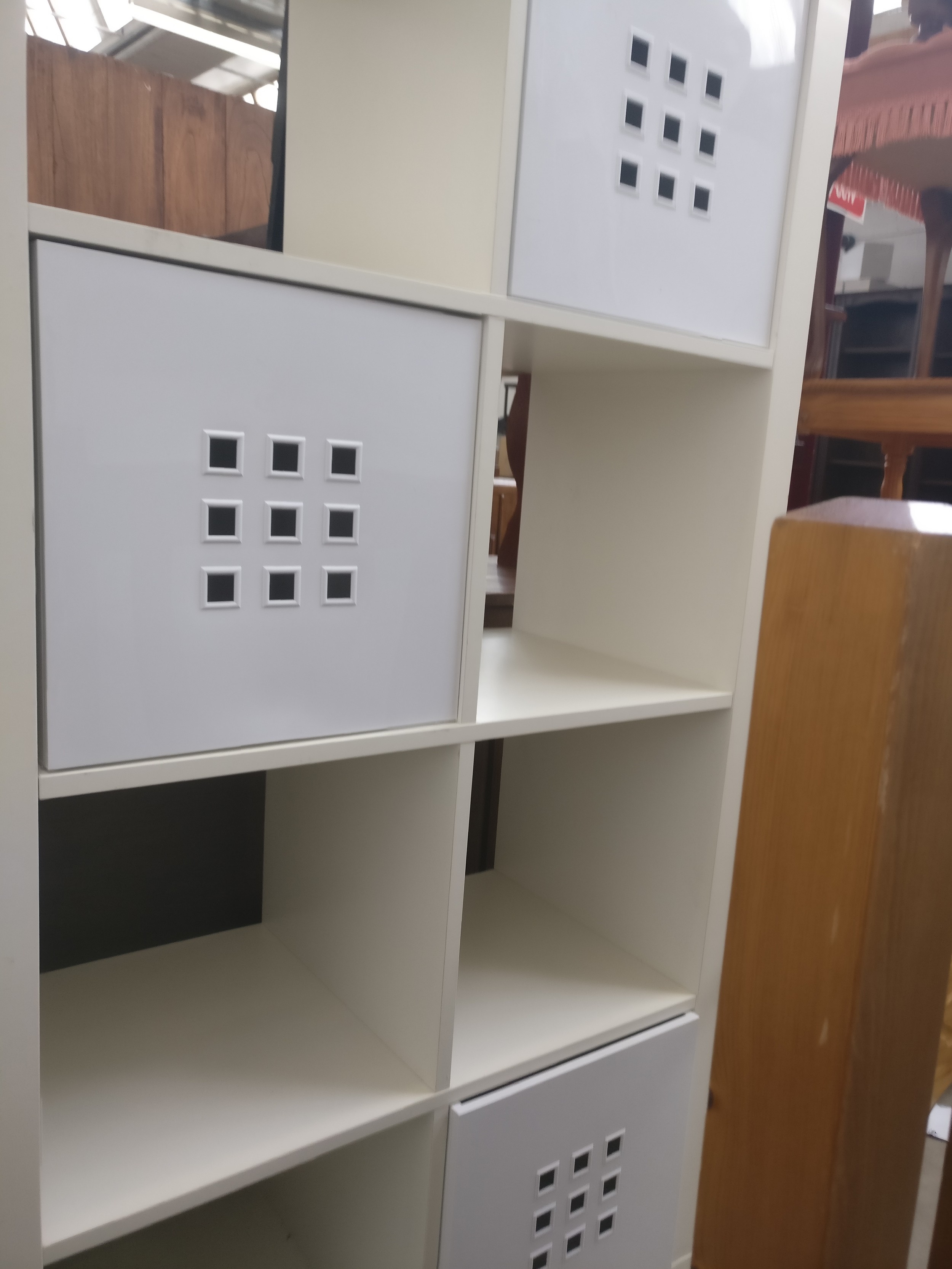 A large modern cubed storage stand with 3 x plastic storage boxes