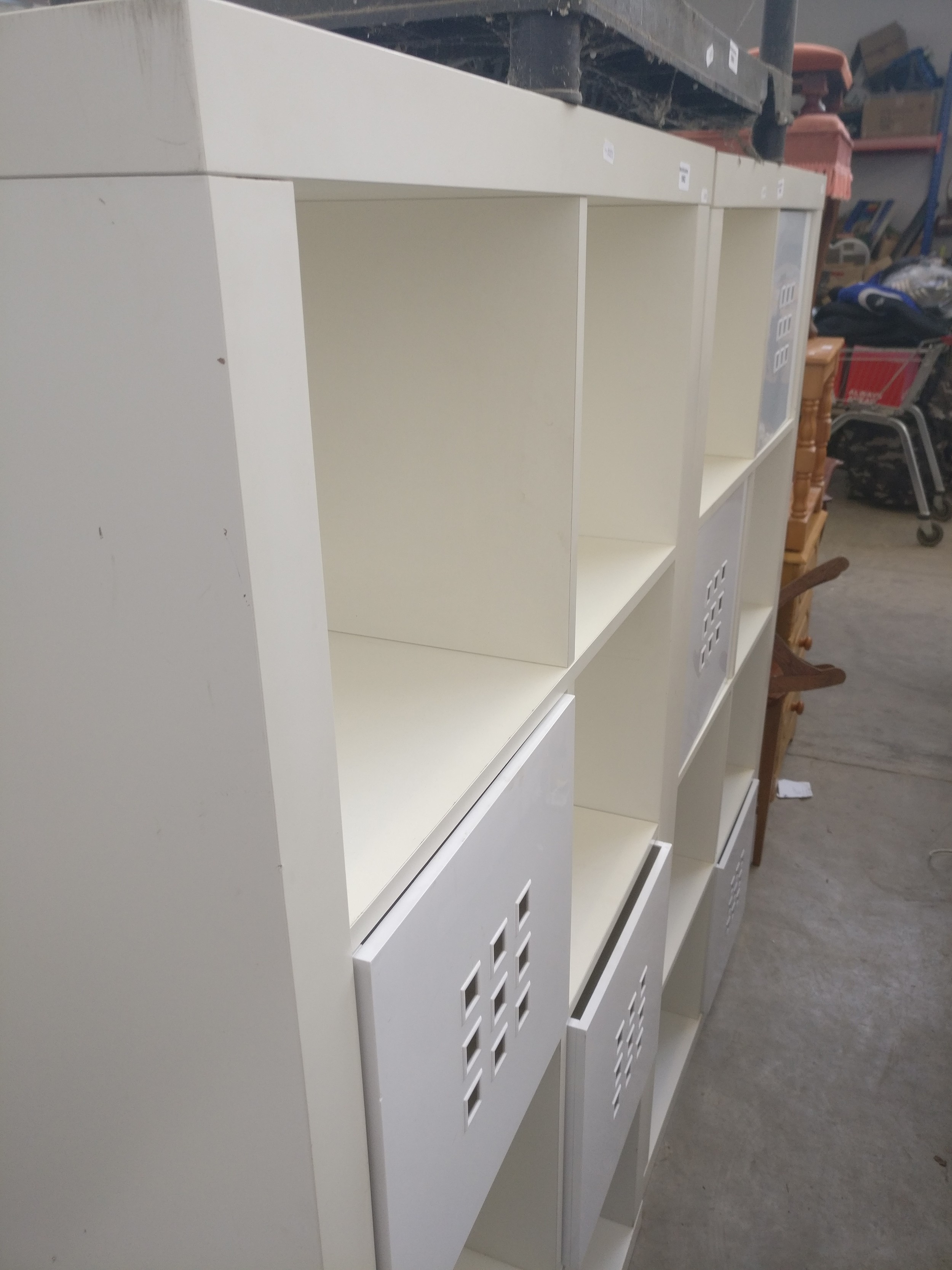 A large modern cubed storage stand with 2 x plastic box drawers
