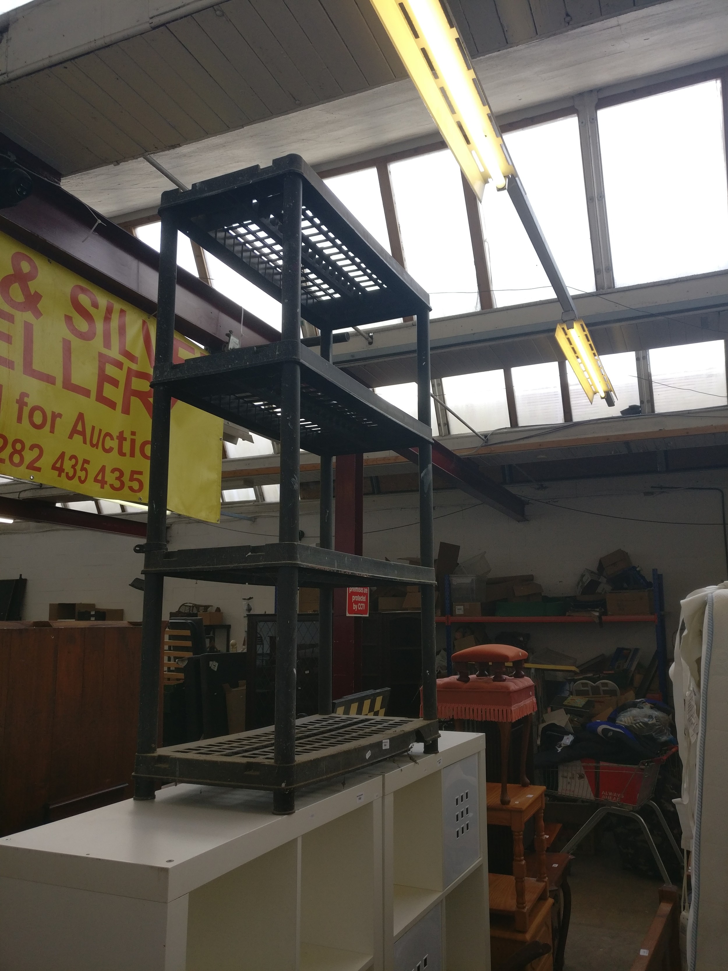 A 4 tier plastic stacking shelf stand