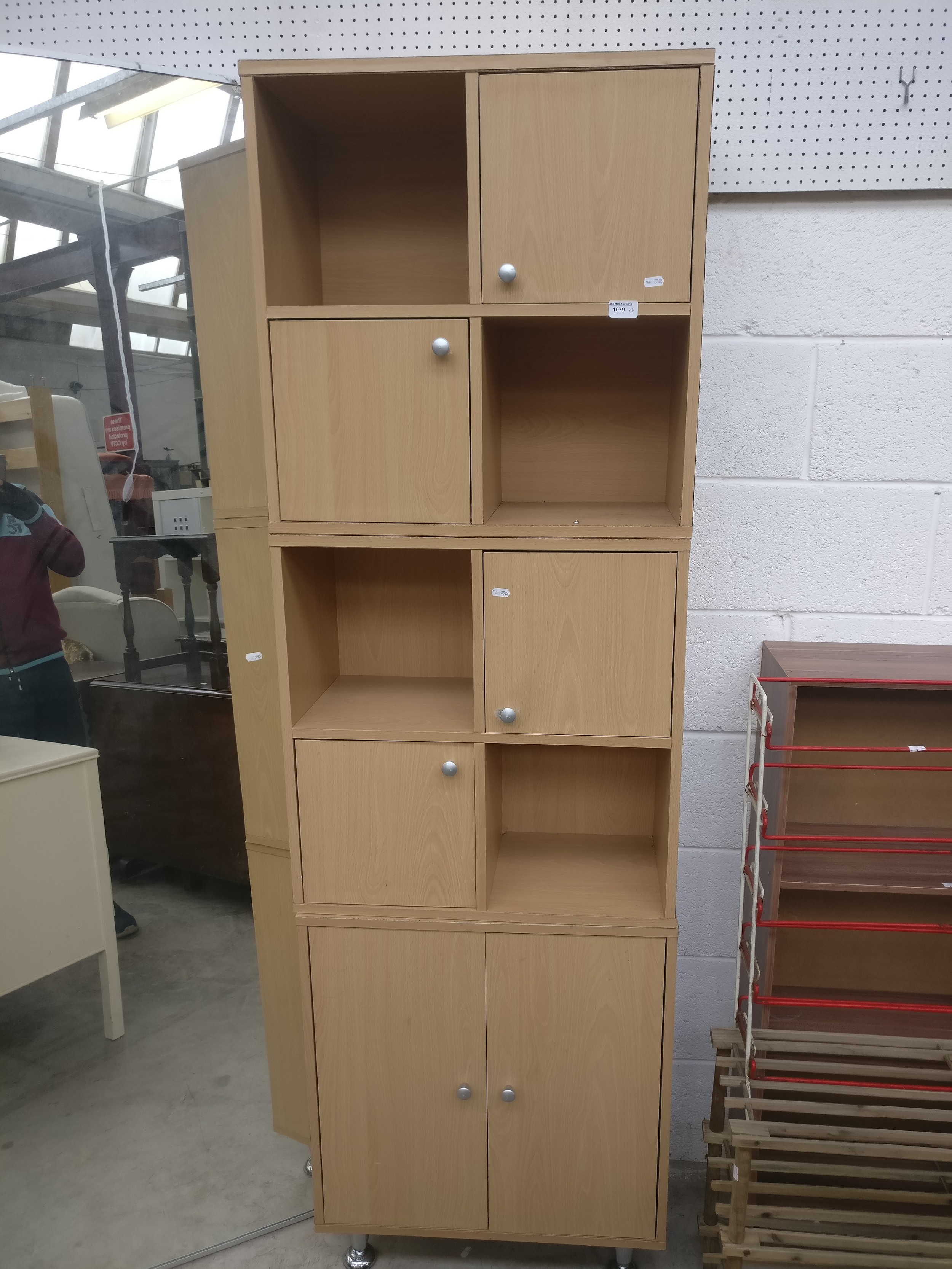 A 3-part storage unit with double cupboard and 2 x cube units