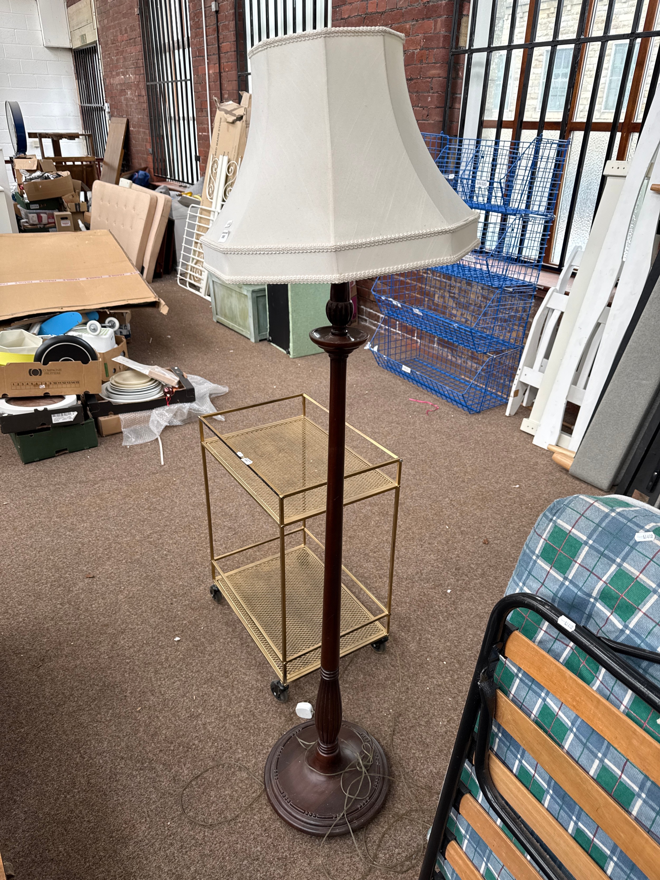 A vintage standard lamp with shade