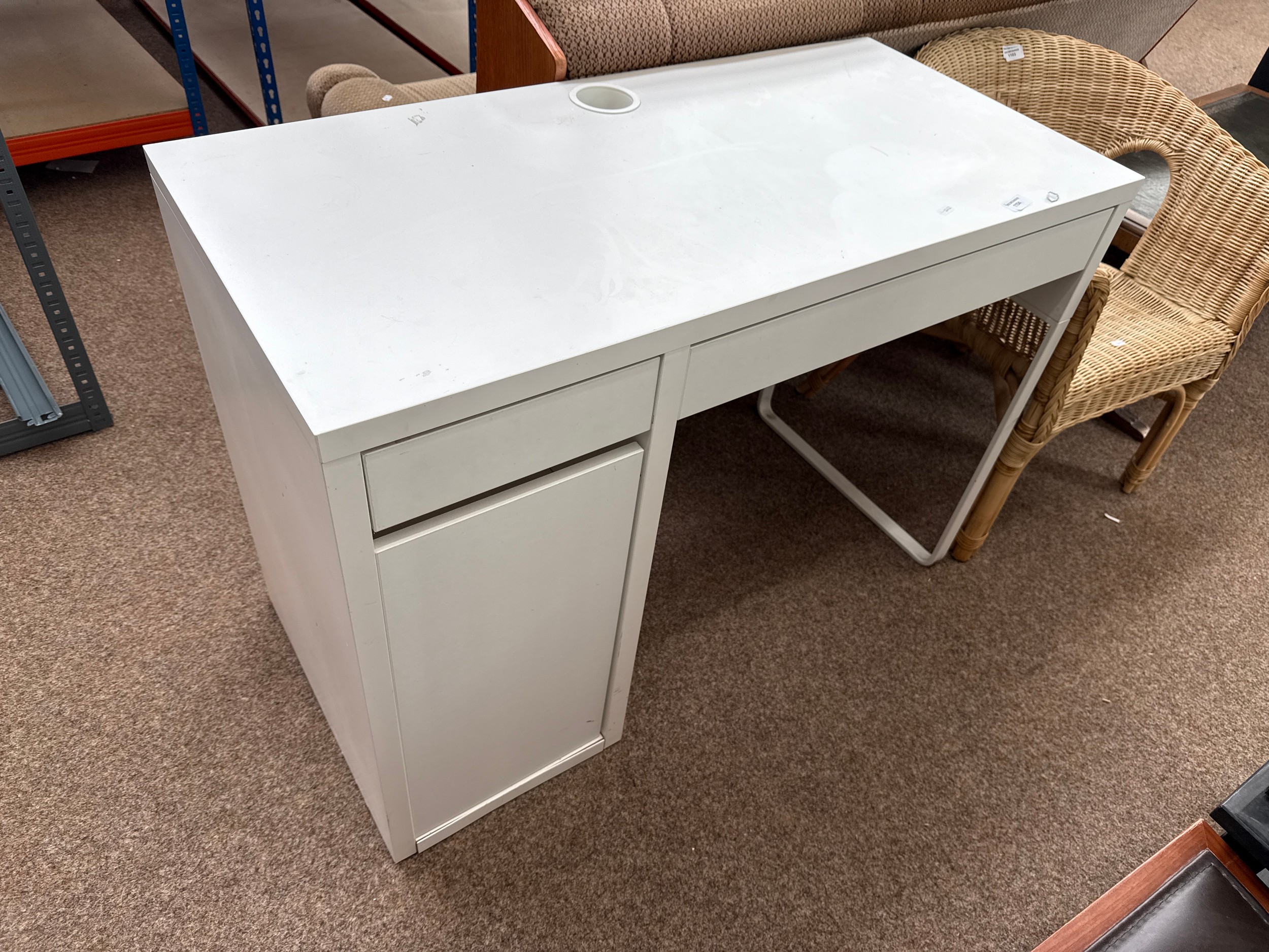 A small modern white 2 drawer desk/dressing table with side cupboard
