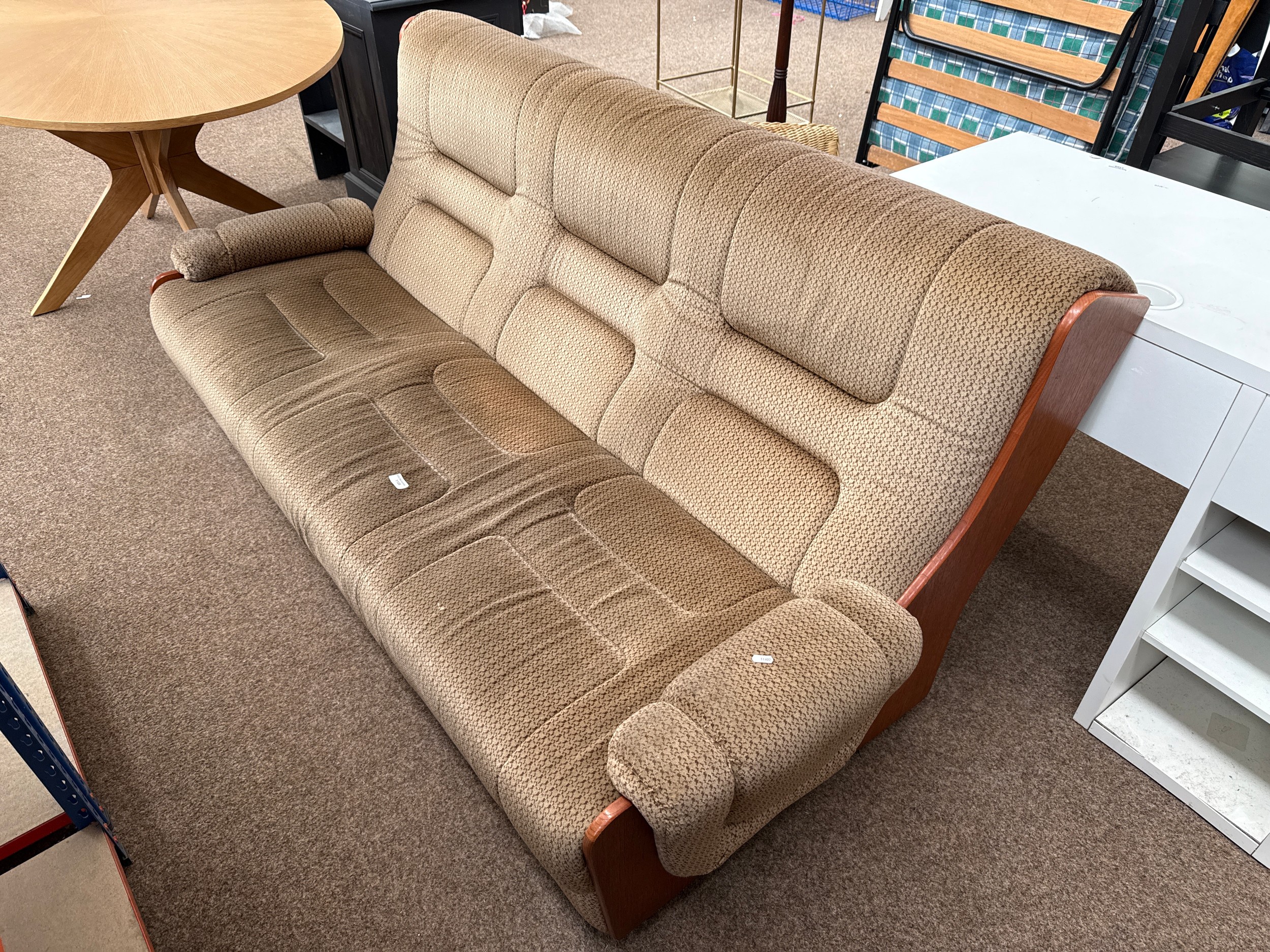 A large wood framed upholstered settee