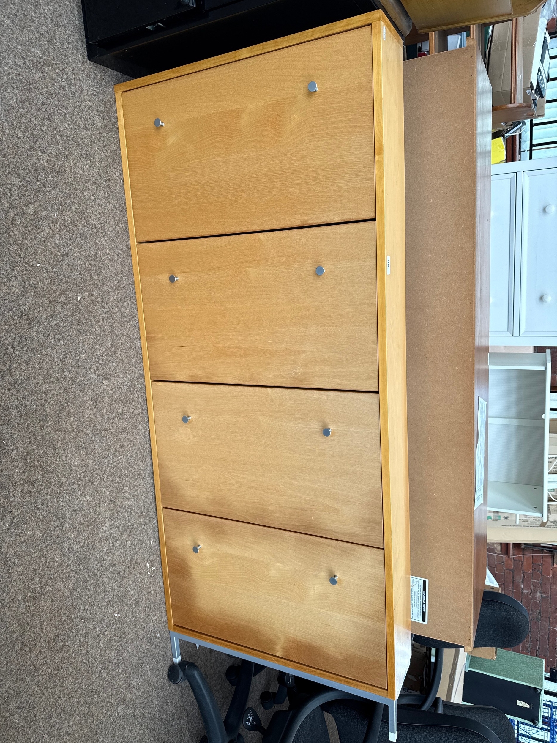 A slim wall mounted 4 x tier shoe storage unit