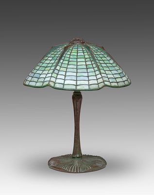 Tiffany Studios. "Spider" table lamp, circa 1910. Geometric Favrile glass and patinated bronze. 