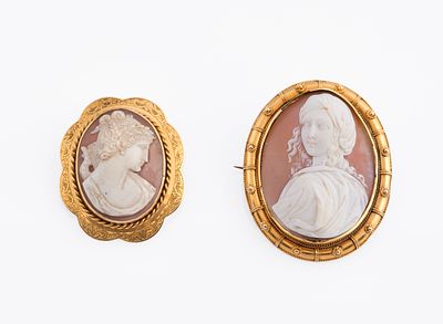 Two gold and shell cameo broochesOf oval design, each centering a shell cameo carved in high 