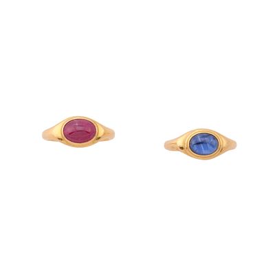 Two multi-gem and gold ringsEach bezel-set with an oval-cut cabochon sapphire or ruby (probably 
