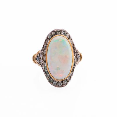 Opal and diamond ringFeaturing an oval cabochon measuring approximately 21,5 x 12,3 mm as 