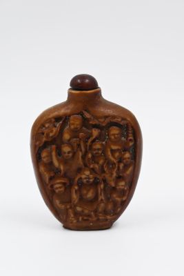 Chinese stone snuff bottle, hand carved. Decorated with delicate reliefs of figures and 
