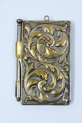 A pocket notebook with a contemporary pen, Europe, early 19th century, decorated with a 
