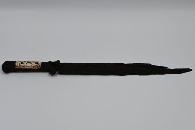 Dagger made of antique iron, Europe, 17th century, decorated with carved work on the handle 