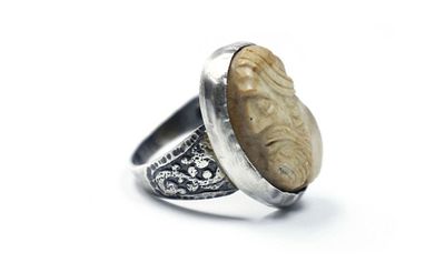 Silver ring with stone seal. 
A silver ring combined with a carved stone seal. Apparently 