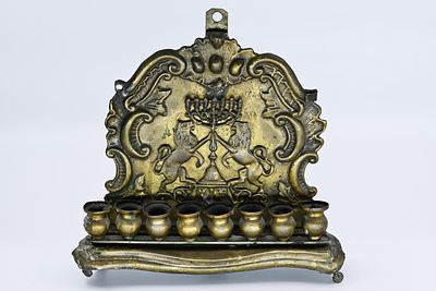 Polish silver-plated Chanukah, Warsaw, circa 1900, decorated with a gilded relief of lions 