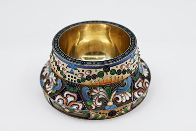 Gilded silver and enamel salt shaker 
1908-1917. Multicolored enamel decorations in a pattern 