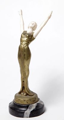 Statue, made of bronze, France, Art Deco, in the form of a woman wearing a golden evening 