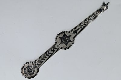 Silver "Hand" for a Torah scroll decorated with niello - Iraq, late 19th century 
A "hand" made 