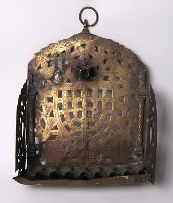 A copper menorah. Morocco, fenced. The end of the 19th century. 
Copper menorah for hanging. 