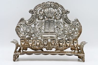 Chanukah – Austro-Hungarian style 
Silver Chanukah, hammered and cut. 
Chanukah in the shape 