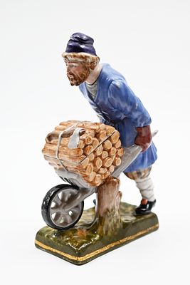 Porcelain figurine, Gardner 
Russian porcelain figurine made by Gardner, man with wheelbarrow. 