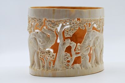 Old African carving, handmade by a master of carving, shows elephants, diameter: 14 cm.