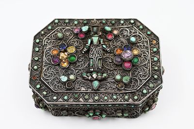 Tibetan jewelry box from the early 20th century, inlaid with turquoise, coral and glass stones 