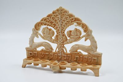 A special menorah, made of carved iv-o-ry - Israel, 20th century, extremely rare! 
Reindeer 
