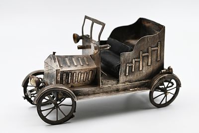 Antique European car. Antique European Car 
An antique silver car model, Europe-Italy, signed. 