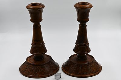 A pair of large and impressive candlesticks made of olive wood, decorated by hand in the holy 