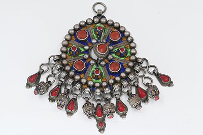 A huge silver and enamel chest pendant, Berber-Algerian, late 19th century. Consists of 