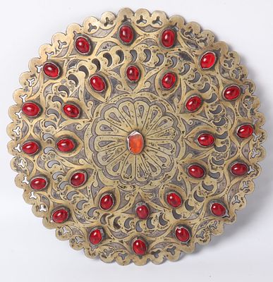 Chest shield jewelry made of silver inlaid with red gems, Turkmen, 19th century. Diameter 