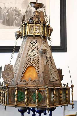 Damascus Synagogue Oil Lamp 
A monumental Jewish oil lamp made of brass, inlaid with silver and 
