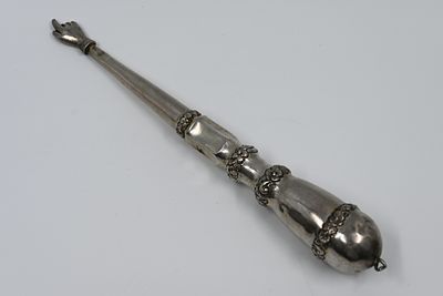 A silver Torah scroll hand, Alt Wien, Austria-Hungary, dated 1860. marked. 
A hand for a 