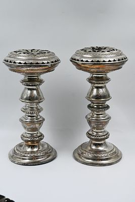 A pair of silver plated Torah pomegranates. 
A pair of pomegranates coated with a Torah 