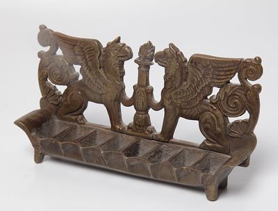 Menorah made of bronze, Italian style, the back of the menorah is decorated with the figures 