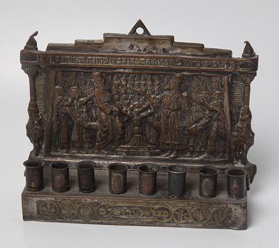 Bezalel Menorah 
Menorah made by Bezalel, Jerusalem, circa 1920. The back of the menorah is 