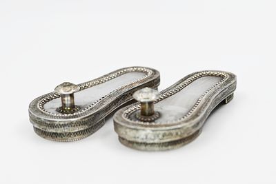 Pair of Miniature Silver Shoes 
A pair of miniature silver shoes, stamped 925, decorated with 