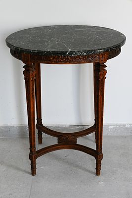 French wood and marble table 
A round French wooden side table. Decorated with carvings. Green 