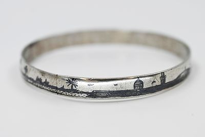 Silver bracelet, Iraq, circa 1920, decorated with a continuous panoramic band in the niello 