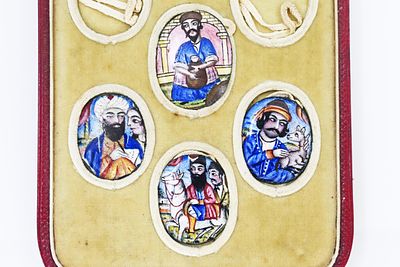 A set of Persian enamel buttons from the Qajar dynasty (19th century), featuring detailed 