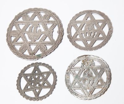 Four round amulets for protection, Tunisia, first half of the 20th century, drilled and 